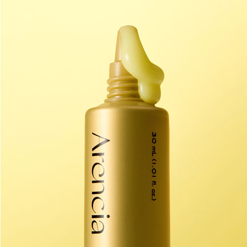 Golden, lightweight texture of Arencia Retinal Booster Shot β Fast-absorbing Korean anti-aging serum for a smooth "Glass Skin" finish at Atelier De Glow UAE.
