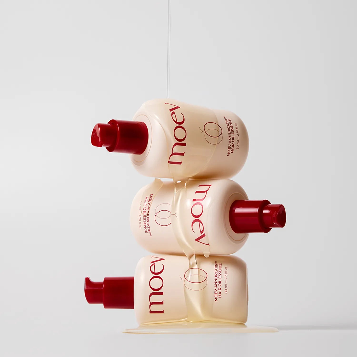 Non-greasy, lightweight texture of MOEV Annurcatin Essence – Fast-absorbing hair oil for a smooth, silky finish and heat protection at Atelier De Glow UAE.