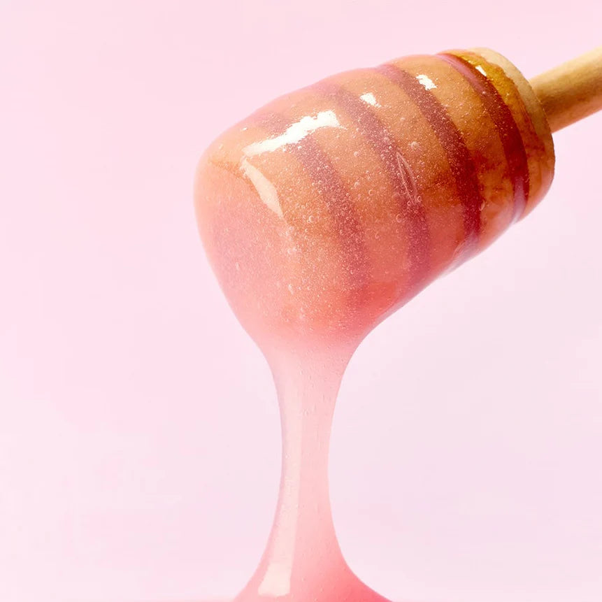Glossy, honey-like texture of Arencia Collagen Lip Mask β High-shine Korean lip treatment for a plumped "Glass Skin" lip look at Atelier De Glow UAE.