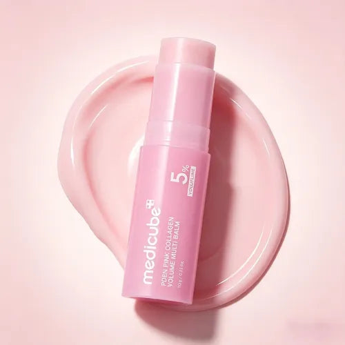 Solid, pastel pink, and ultra-smooth balm texture of Medicube PDRN Pink Collagen Volume Multi Balm gliding effortlessly onto a clear face at Atelier De Glow UAE.