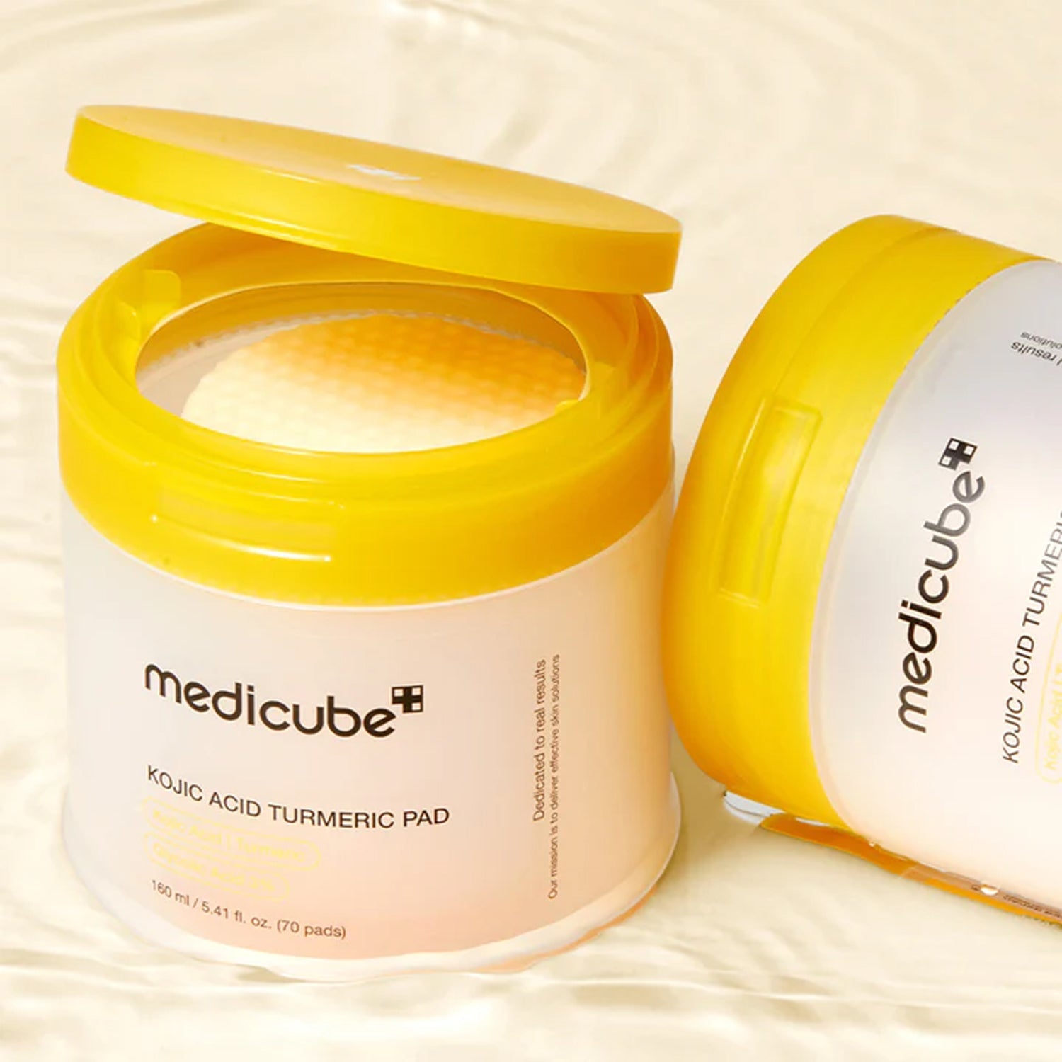 Medicube Turmeric Pads β Professional-grade "Melanin Blockade Swipe & 1-Minute Flash Mask" for securing a flawless, radiant skin canvas, shop at Atelier De Glow UAE.