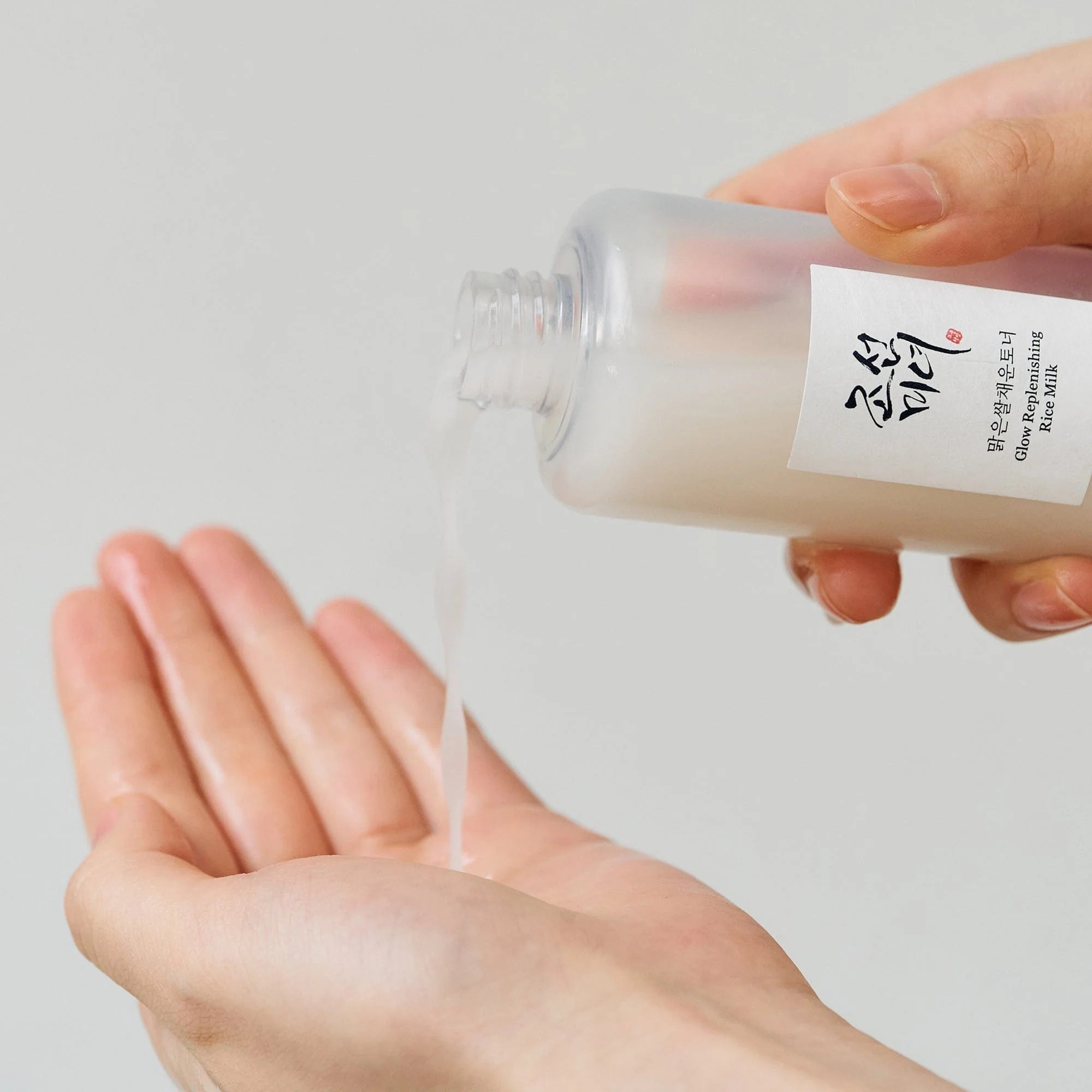 Unique dual-layered milky texture of Beauty of Joseon Rice Toner – Shake-to-activate Korean skincare for "Glass Skin" luminosity at Atelier De Glow UAE.