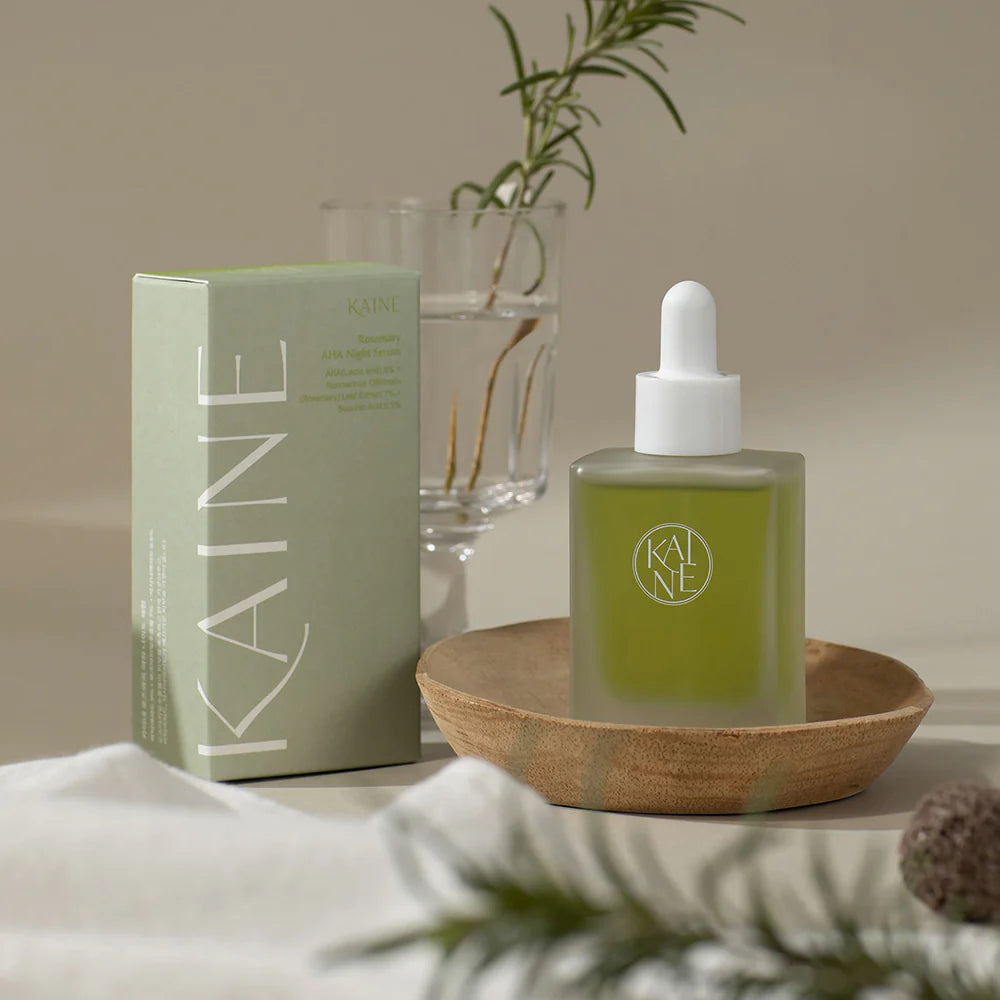 KAINE serum for closed comedones, textured bumpy skin, and dull morning complexion – Gentle "AHA Rosemary" chemical exfoliant from Atelier De Glow UAE.