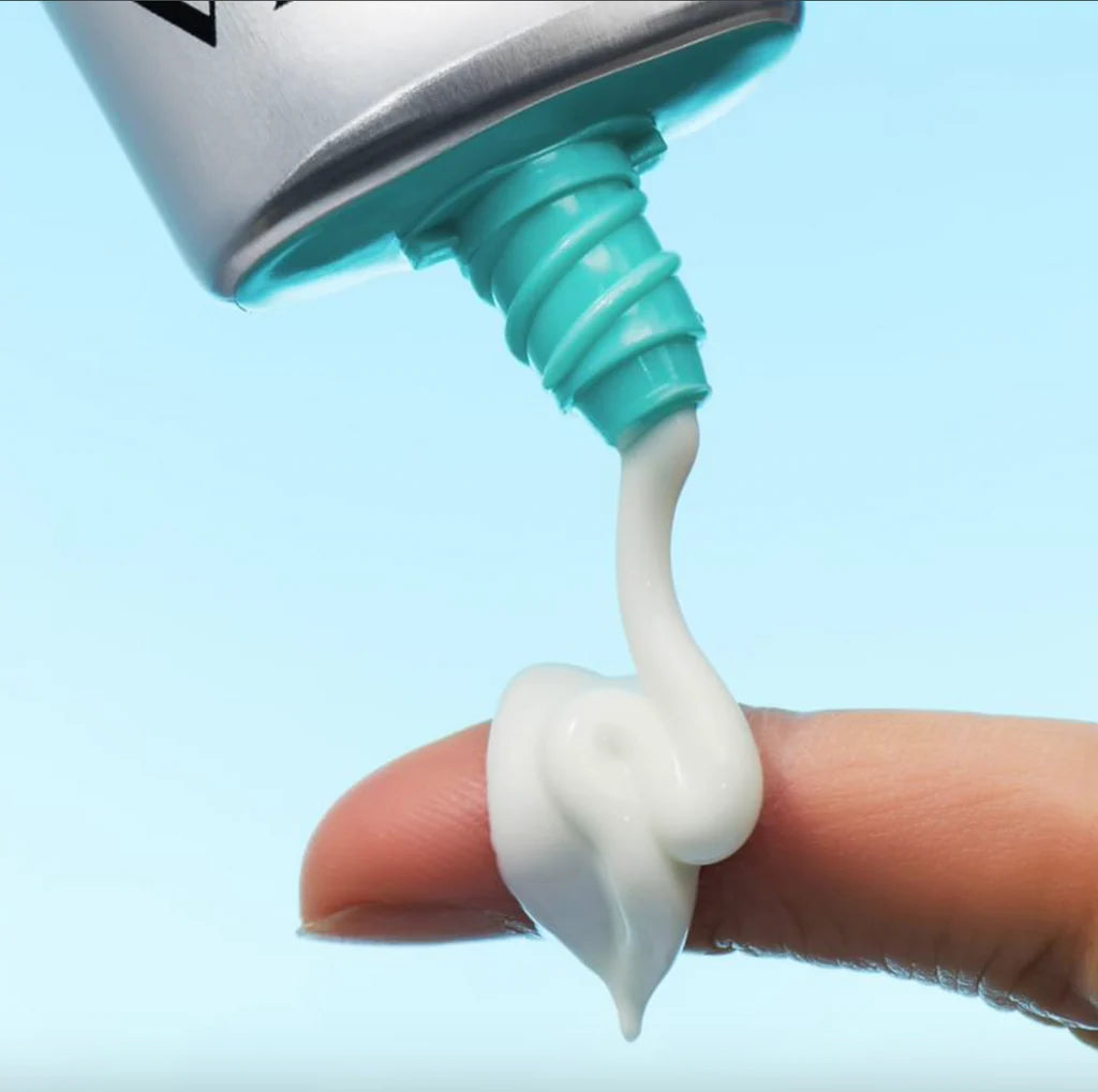 Whipped, airy, and completely translucent clear liquid cream texture of VT Air Cloud Sunscreen absorbing instantly into the skin at Atelier De Glow UAE.
