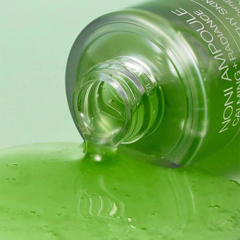 Fresh, green-tinted lightweight texture of celimax Noni Energy Ampoule β Fast-absorbing nutrition for a vibrant, radiant complexion at Atelier De Glow UAE.