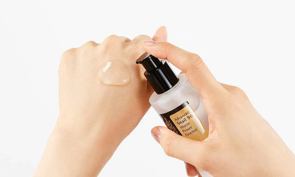 Lightweight, viscous texture of COSRX Snail 96 Power Essence – Fast-absorbing Korean hydrating essence for a dewy "Glass Skin" finish at Atelier De Glow UAE.