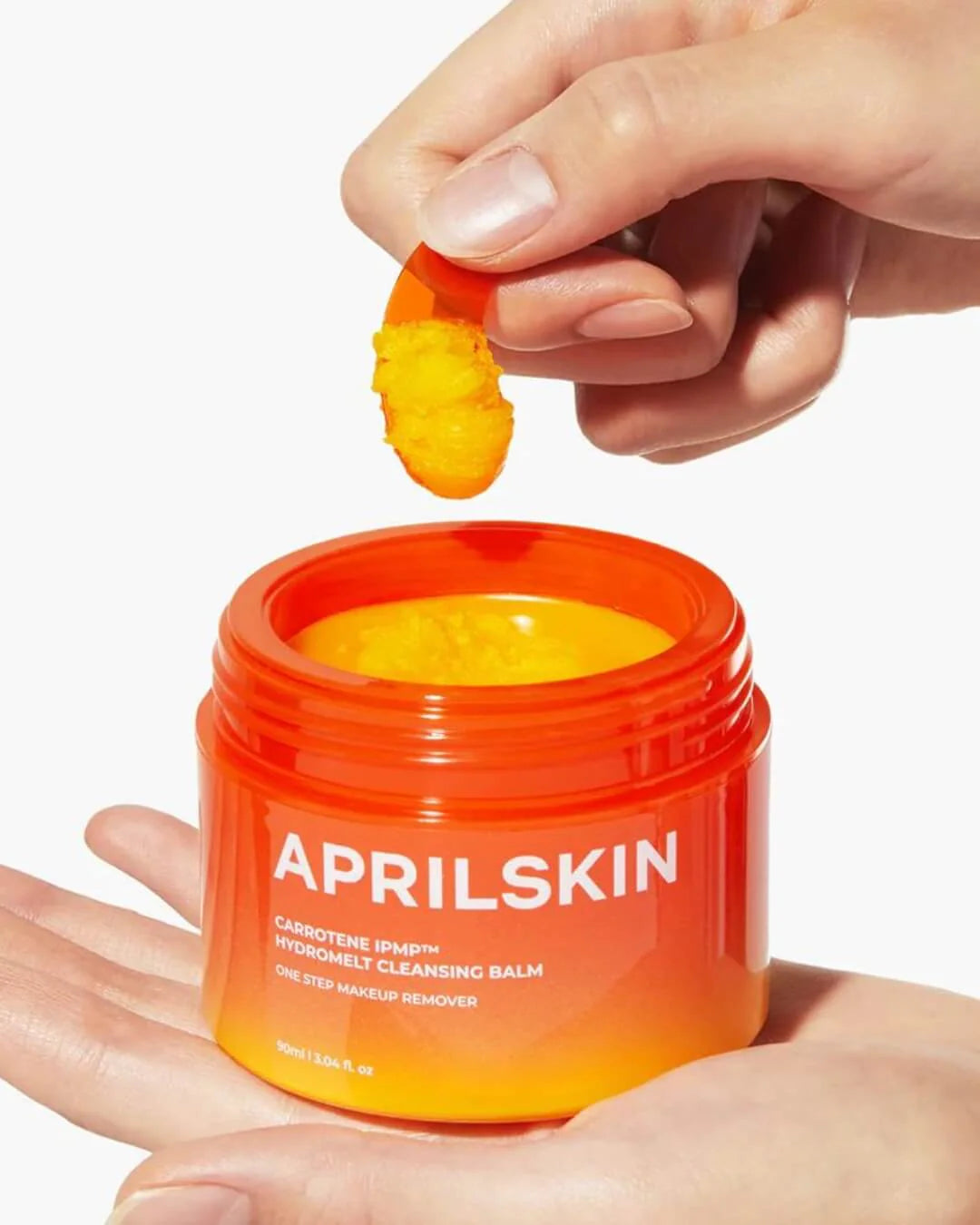 Yellow sorbet texture of APRILSKIN Hydramelt Cleansing Balm – Emulsifying Korean oil-to-milk cleanser for a smooth "Glass Skin" base at Atelier De Glow UAE