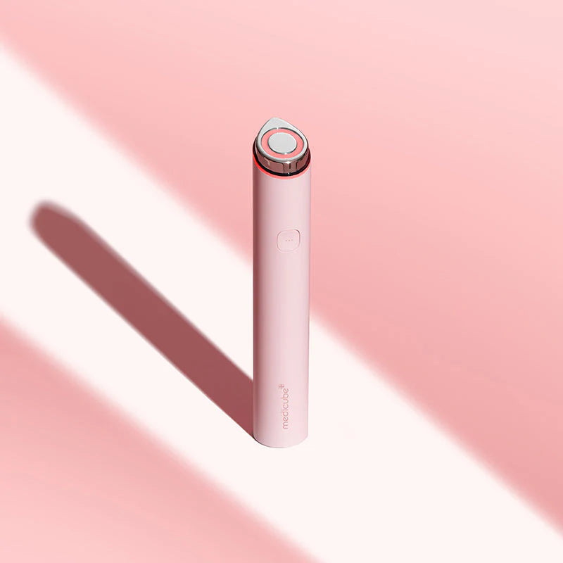 Medicube Mini Booster Pro Pink for sluggish skincare absorption, stretched vertical pores, dark blemishes, and dull post-flight skin – Glow wand from Atelier De Glow UAE.