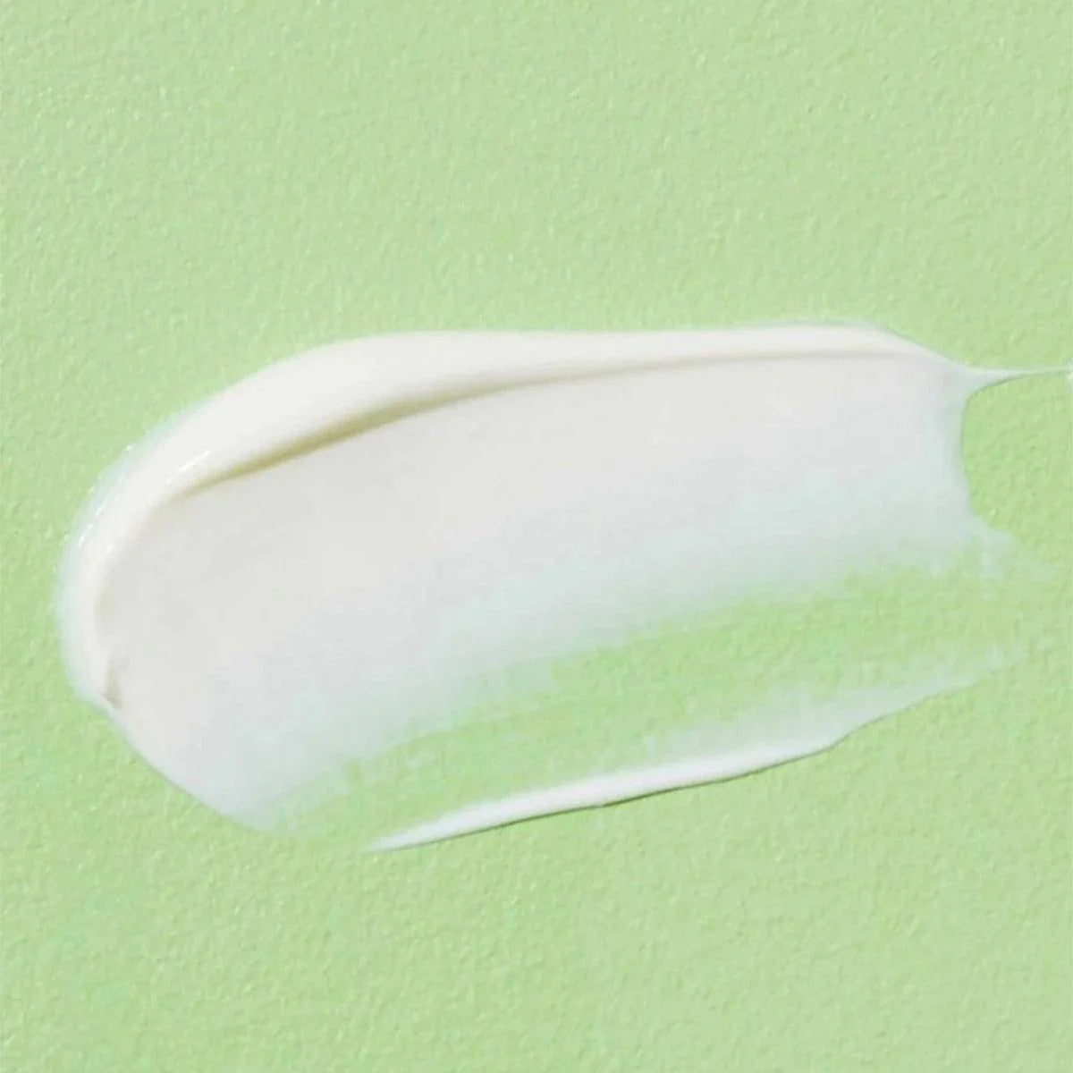 Moisturizing, cream-like texture of COSRX Aloe Soothing Sunscreen – Zero white-cast Korean sunblock for a smooth "Glass Skin" base at Atelier De Glow UAE.