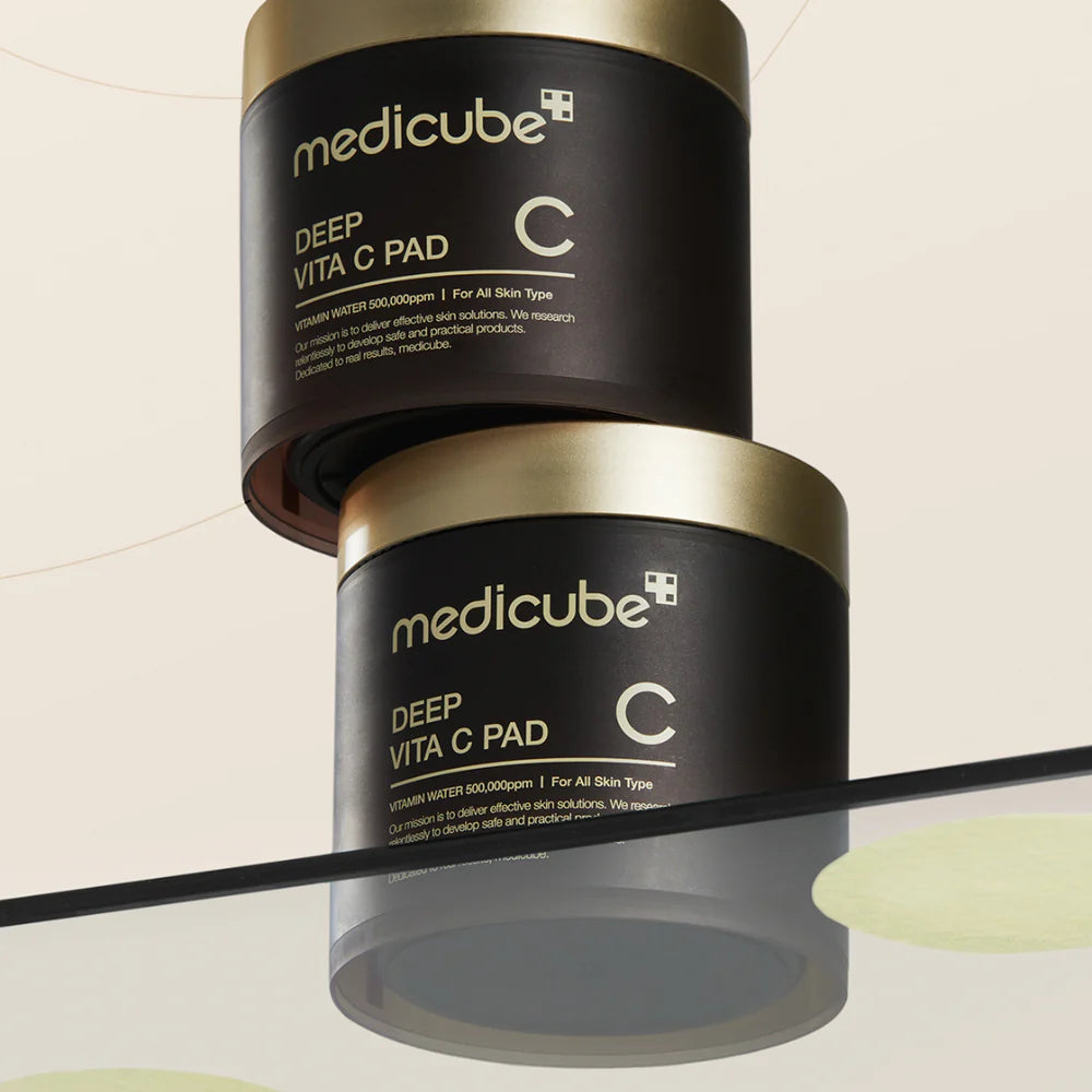Embossed yellow-tinted texture of medicube Deep Vita C Pad – Dual-action exfoliating and brightening Korean toner pads at Atelier De Glow UAE.