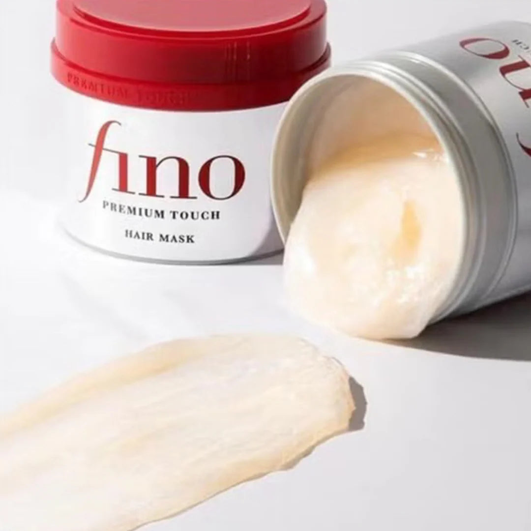 Shiseido Fino Premium Touch Hair Mask for dry, brittle, and heat-damaged hair, designed to restore moisture and shine for a salon-quality finish from Atelier De Glow UAE.