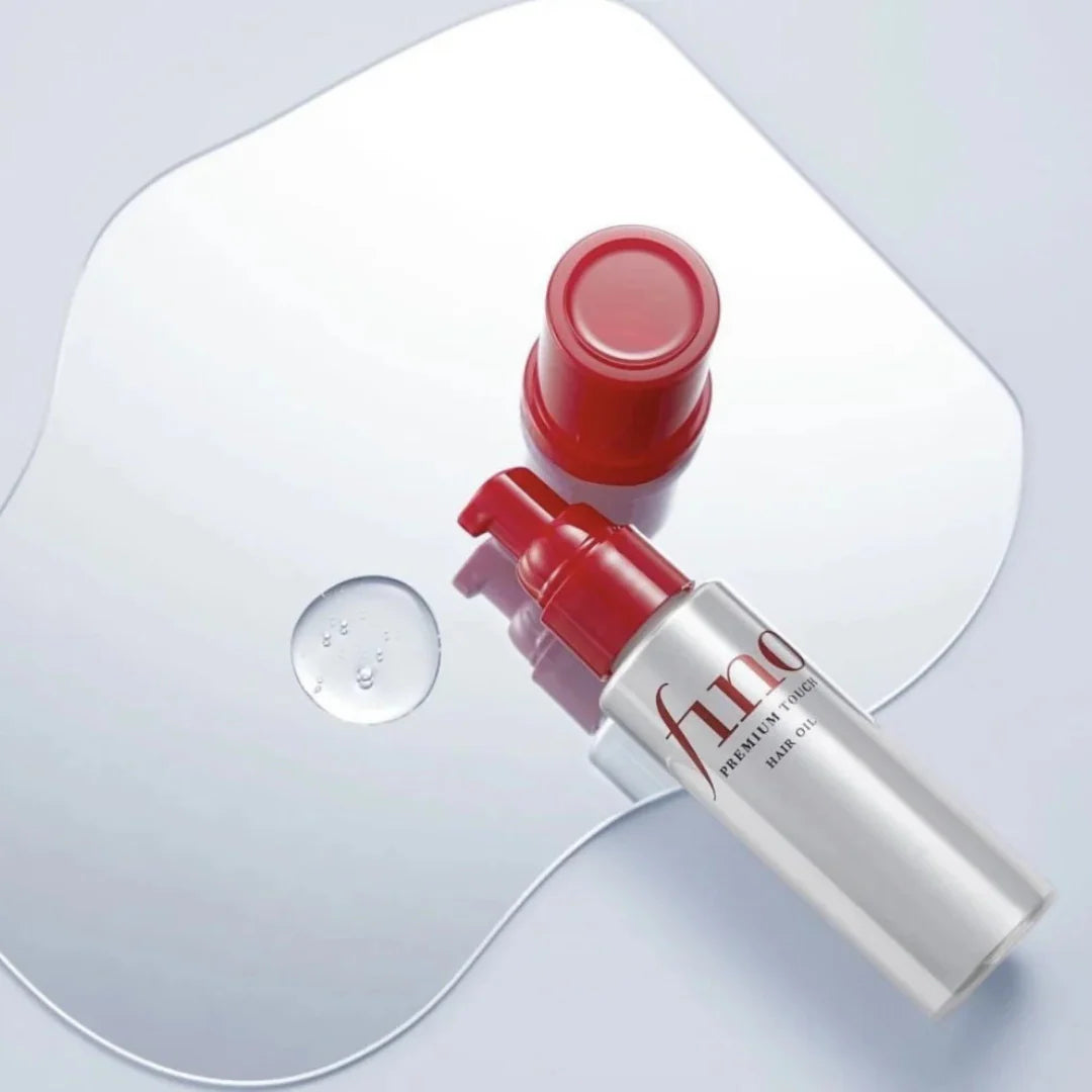 Shiseido Fino Premium Touch Serum Hair Oil for repairing dry, damaged, and frizzy hair, providing instant shine and smoothness from Atelier De Glow UAE.