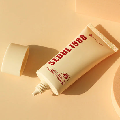 Weightless, smooth lotion texture of KSECRET SEOUL 1988 Ceramide Sunscreen absorbing completely clear with zero white cast at Atelier De Glow UAE.