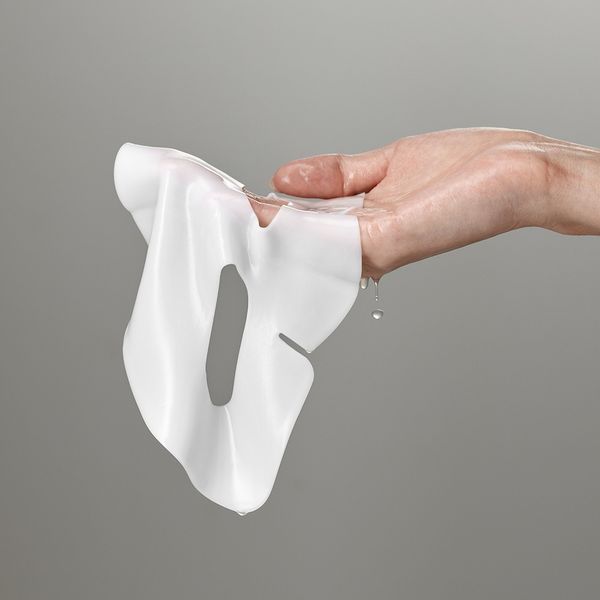 Opaque white, thick, and premium cooling split-hydrogel texture of SUNGBOON EDITOR Power Boosting Mask conforming flawlessly to the face at Atelier De Glow UAE.