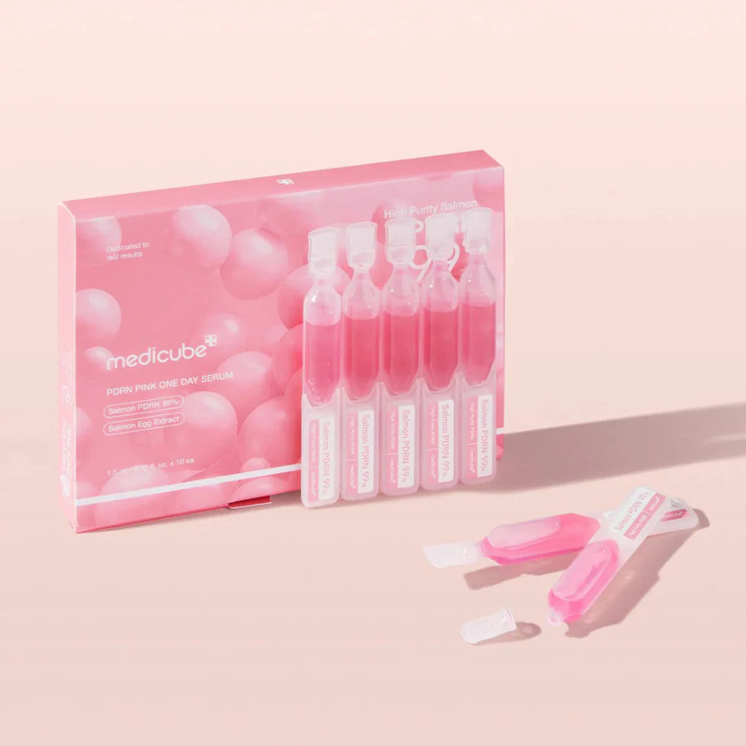 Smooth, weightless, and naturally pink-tinted concentrated fluid dispensing from an individual pod of Medicube PDRN One Day Serum at Atelier De Glow UAE.