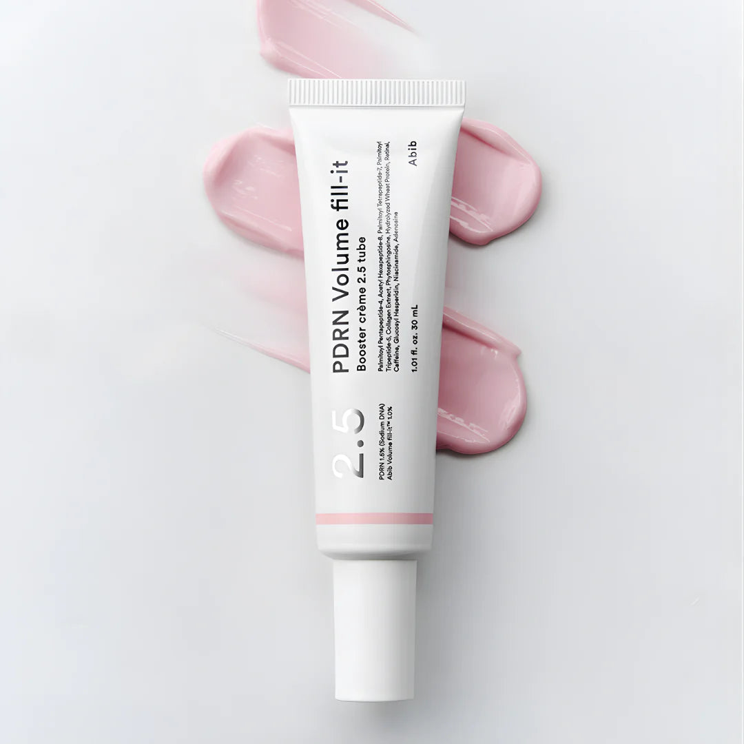 Rich, silky, and precise targeted cream texture of Abib Volume Fill-it Booster Crème dispensing directly from its fine needle-tip tube at Atelier De Glow UAE.