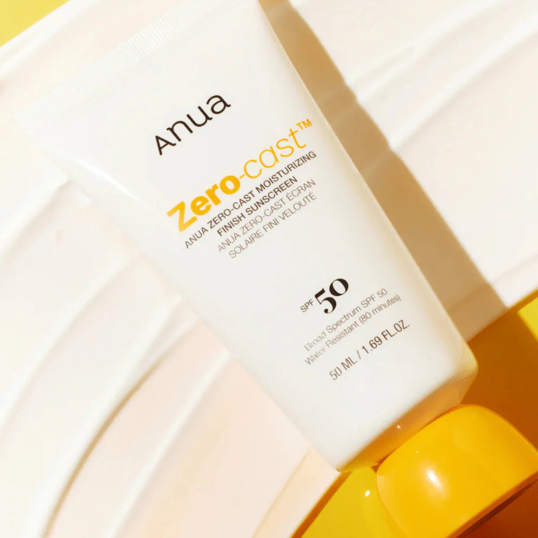 Lightweight Anua Zero-Cast Sunscreen texture – Moisturizing Korean sun lotion finish for a "Glass Skin" glow without white residue at Atelier De Glow UAE.