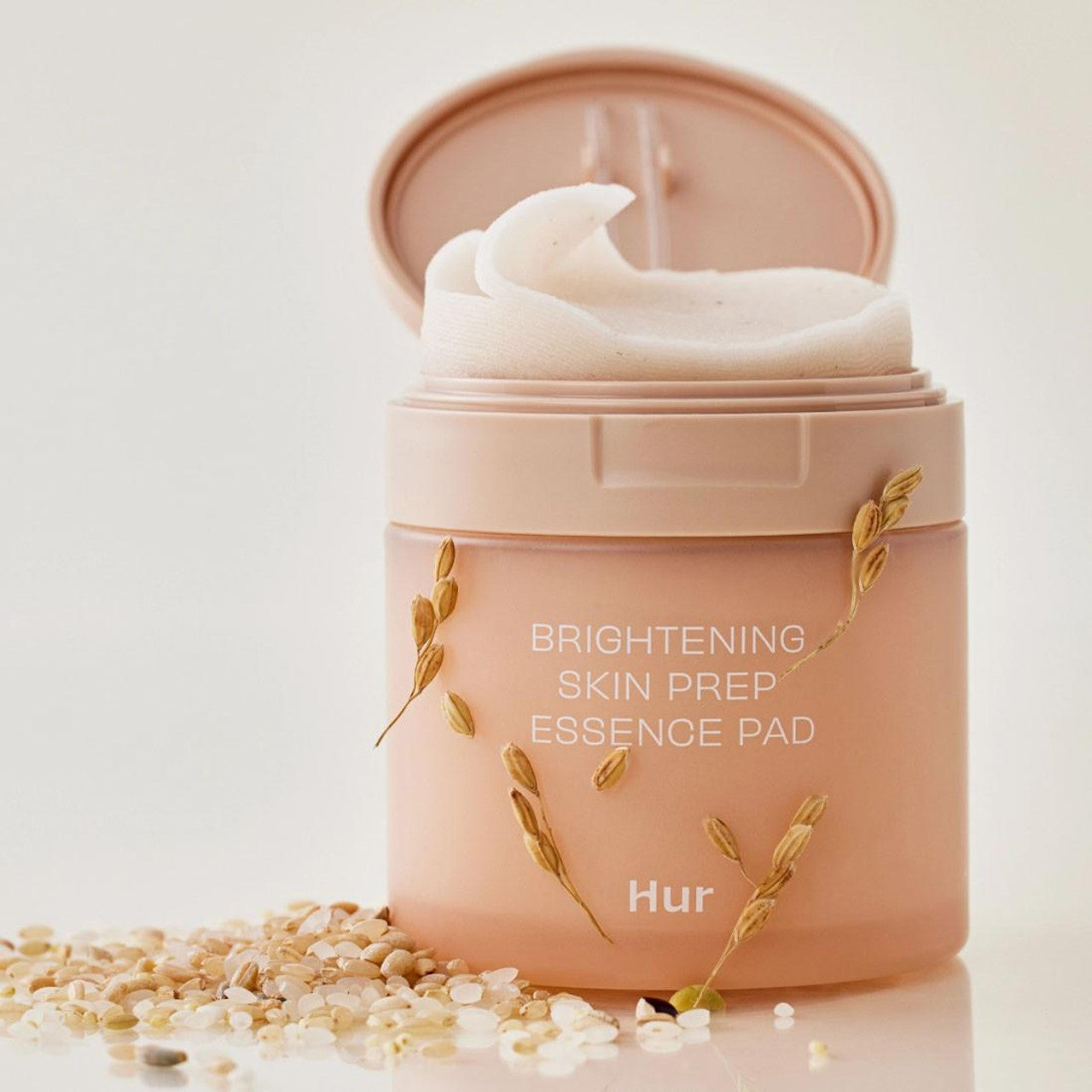 Large, fully-soaked embossed pads of House of Hur Brightening Essence – Dual-sided Korean skin prep for a radiant "Glass Skin" finish at Atelier De Glow UAE.