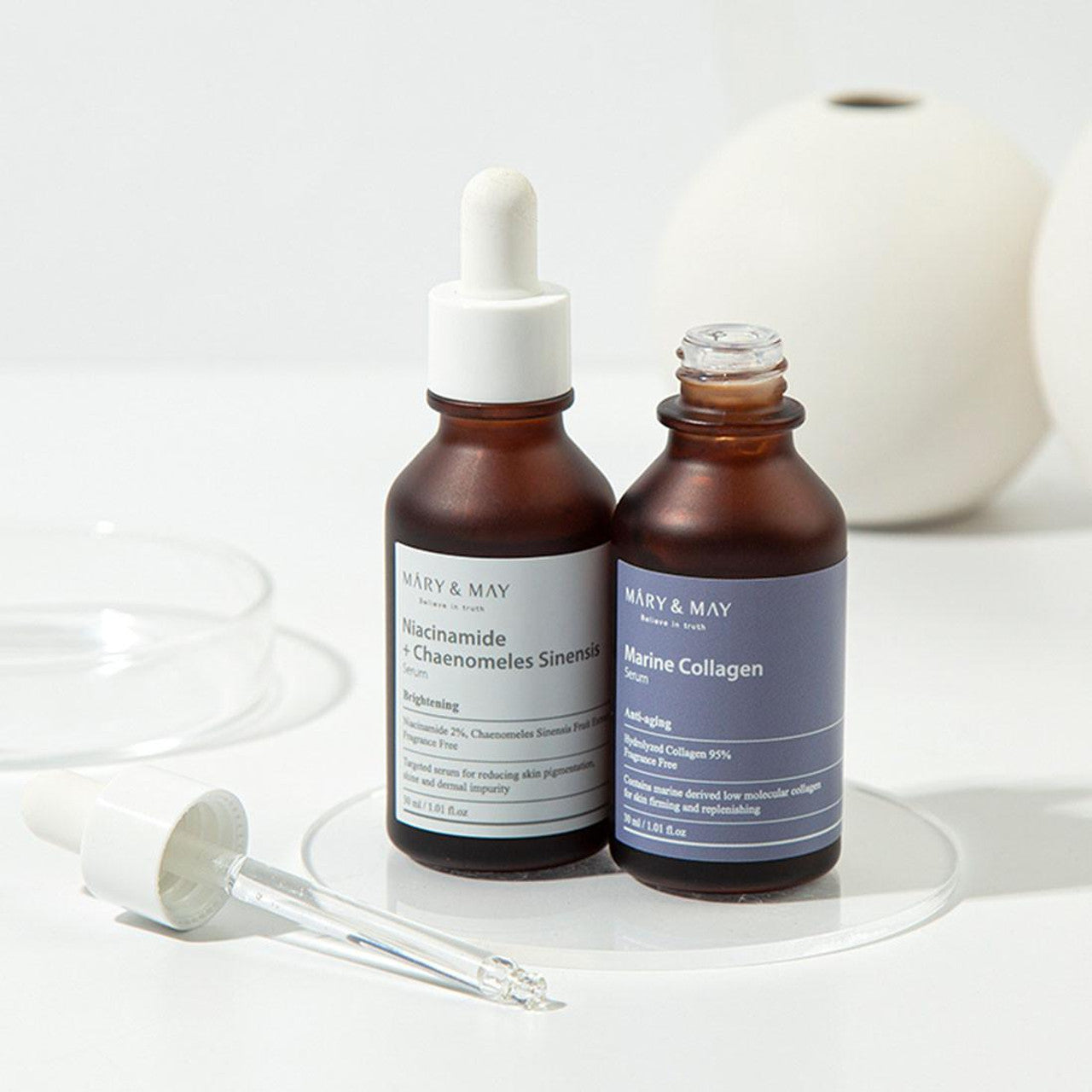 Crystal-clear, lightweight, and fluid watery texture of MARY &amp; MAY Marine Collagen Serum absorbing instantly into dry skin at Atelier De Glow UAE.