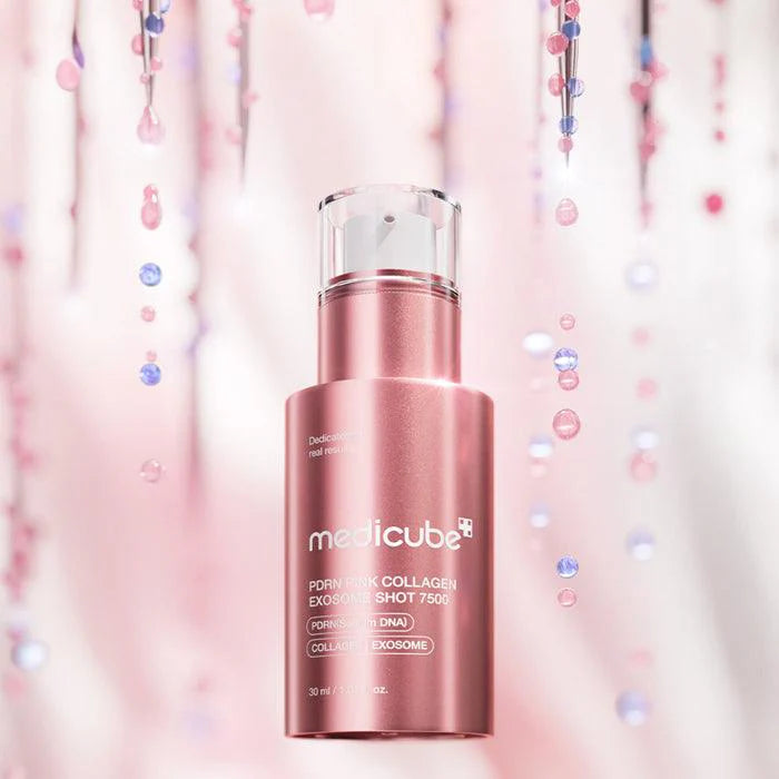 Rich, slinky, and naturally pink-tinted advanced fluid texture of Medicube PDRN Pink Exosome Shot 7500 being pressed into a mature skin canvas at Atelier De Glow UAE.