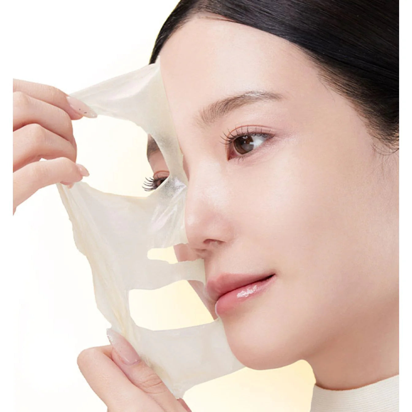 Rich, golden gel-cream texture of Medicube Kojic Acid Turmeric Night Mask setting into an invisible, clear, and peelable film sheet at Atelier De Glow UAE.