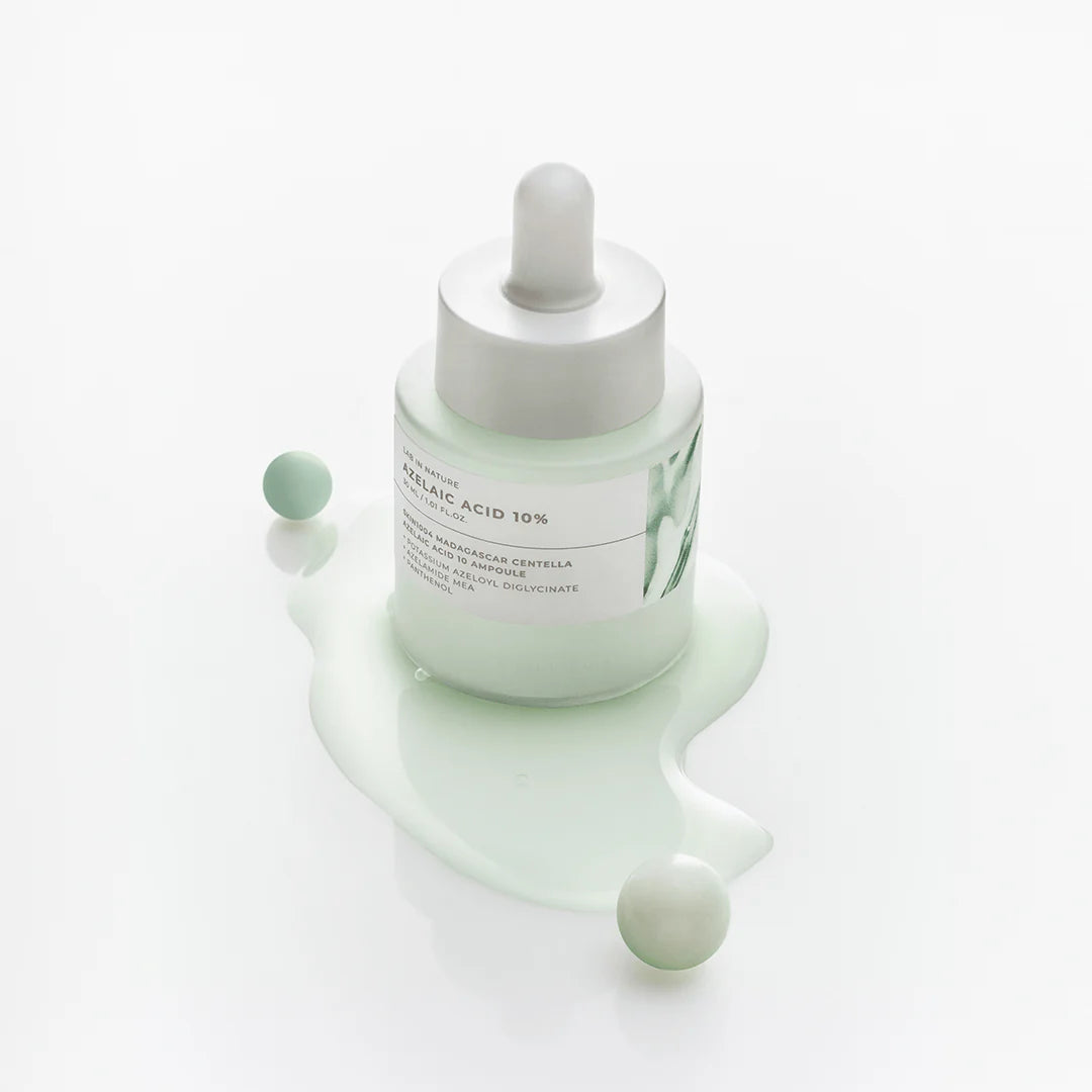 Weightless, watery, and non-sticky clear fluid gel texture of SKIN1004 Azelaic Acid 10 Ampoule absorbing into a texturized face at Atelier De Glow UAE.